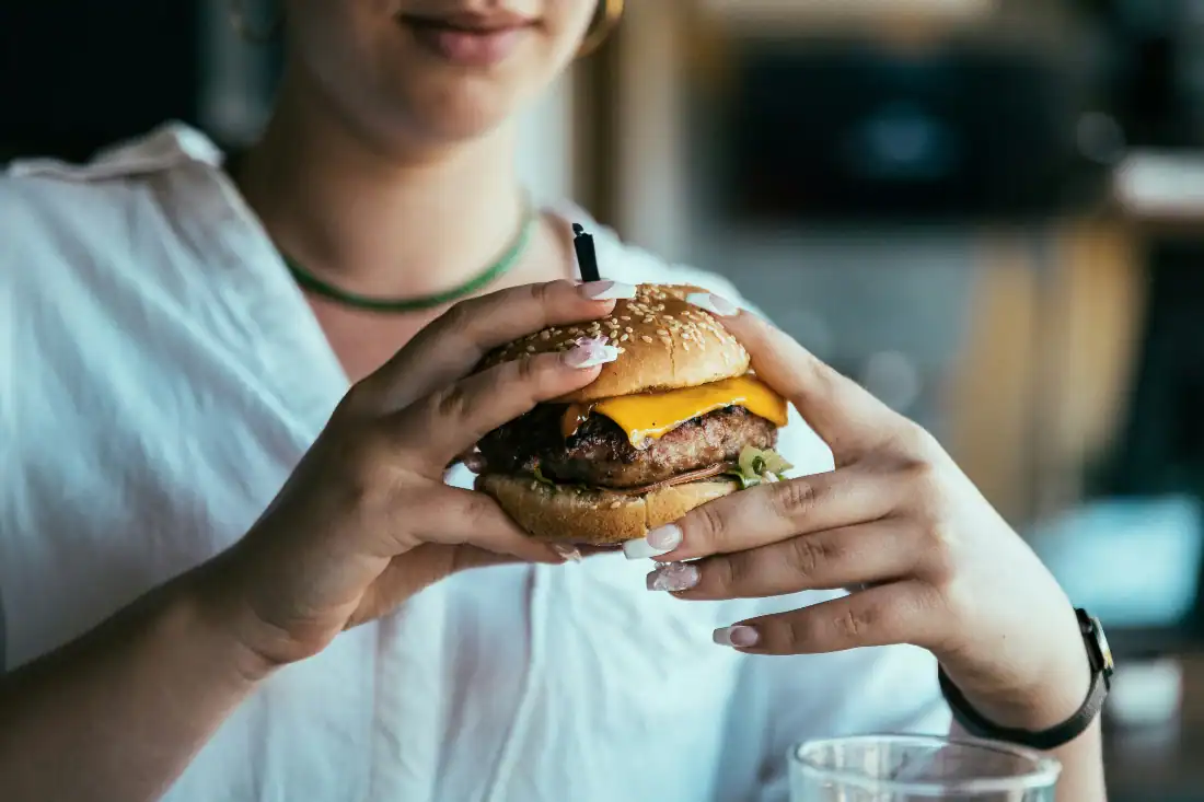 a woman eating her favorite snacks