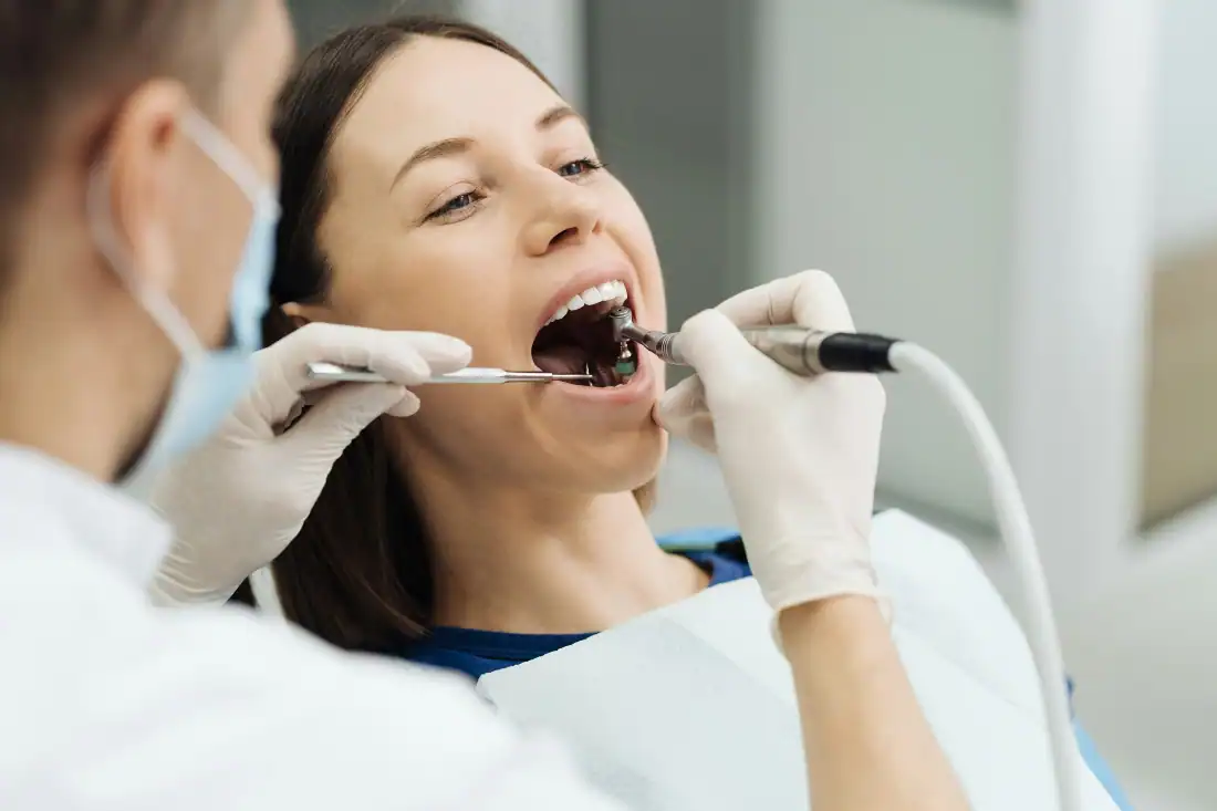 Dental visit, a girl checks her oral hygiene in a dental office