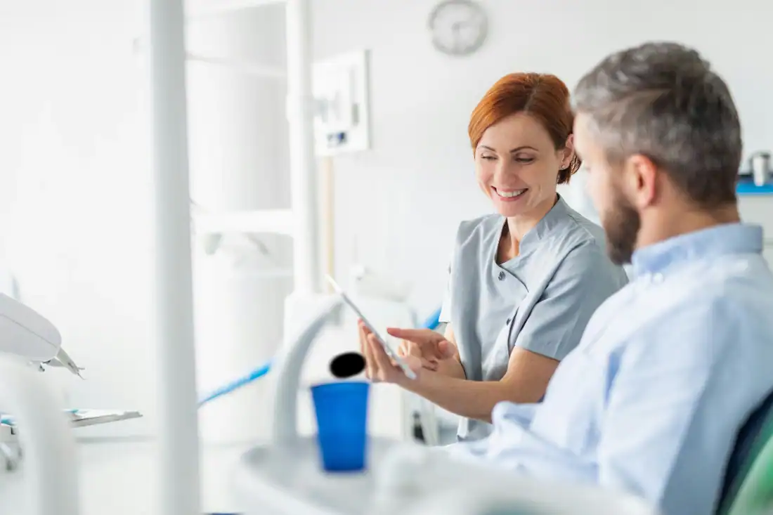 patient and dentist in a clinic for a dental bridge procedure