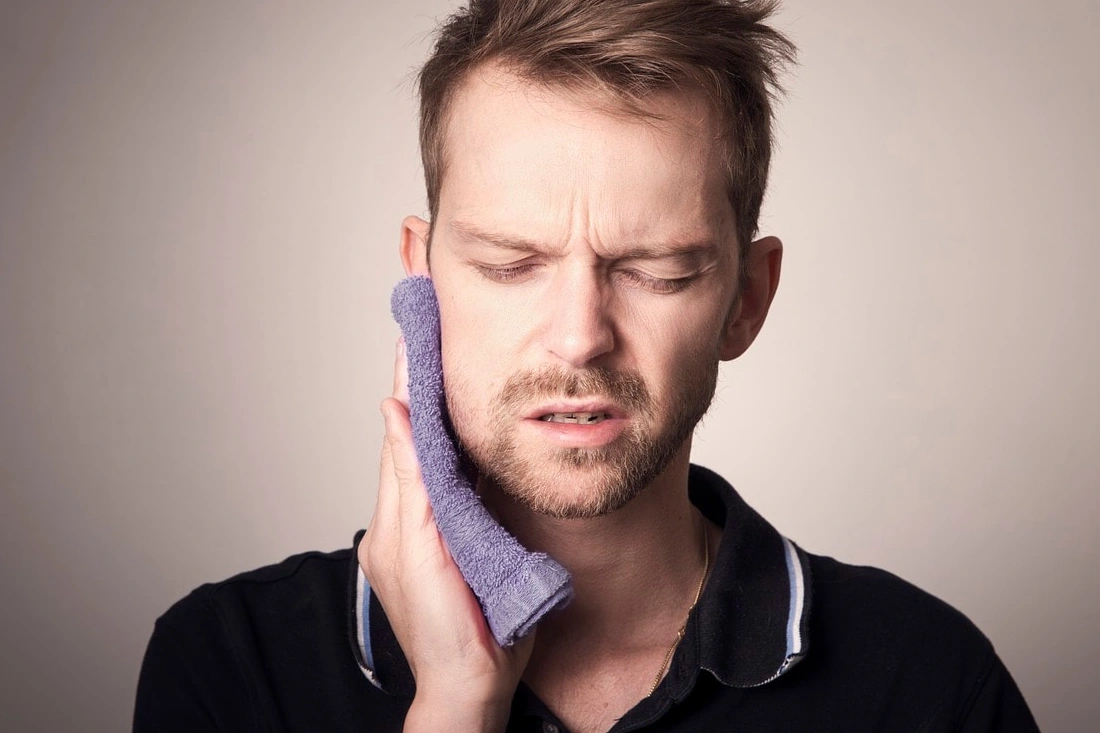 man experiencing pain or discomfort