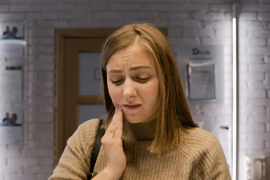 woman in pain from tooth decay