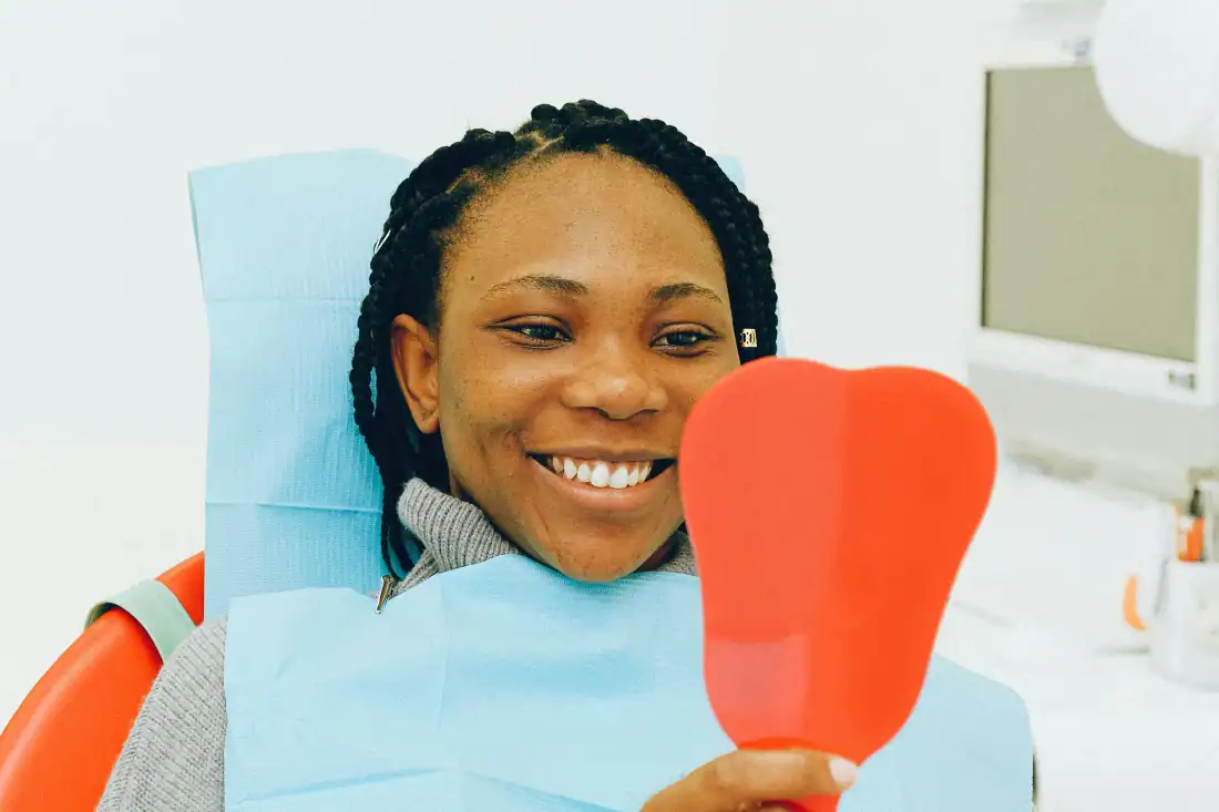 happy patient with new crown