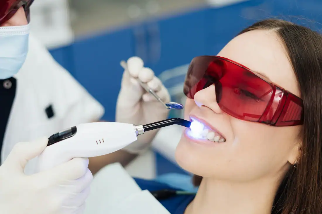 laser dentistry, dental lasers and suction used on female patient