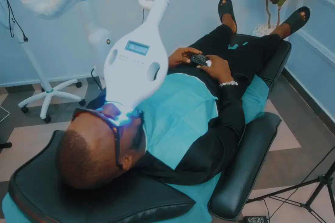 Orthodontist Using Dental Scaler While Doing Check-Up For Client