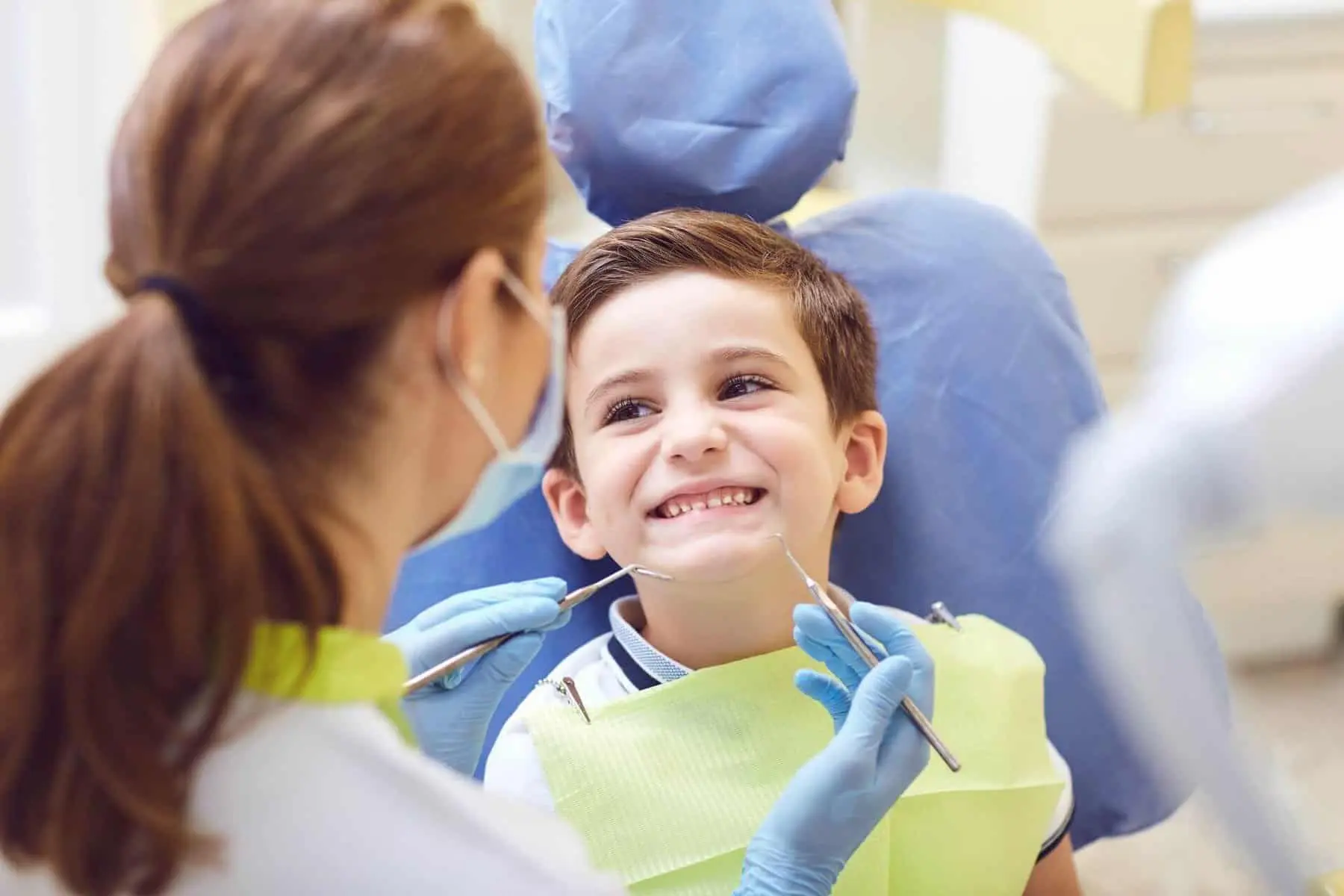 Dentist giving Pediatric Dental Treatments