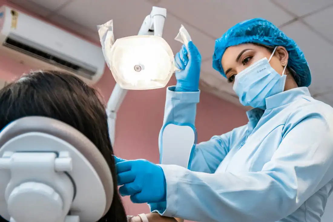 dentist using dental lasers used for dental procedures that are minimally invasive
