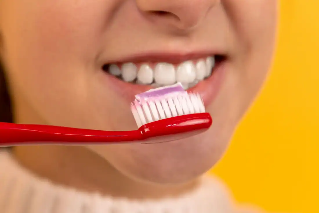 girl brushing her teeth