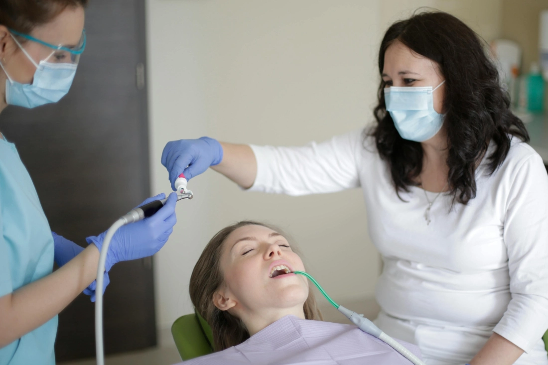Dentist and patient during a dental filling replacement appointment.