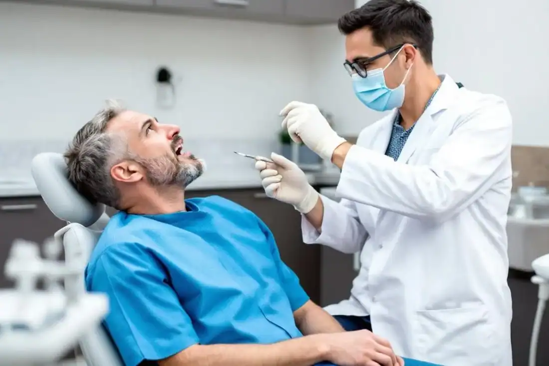 a dentist discussing dental implants to a patient
