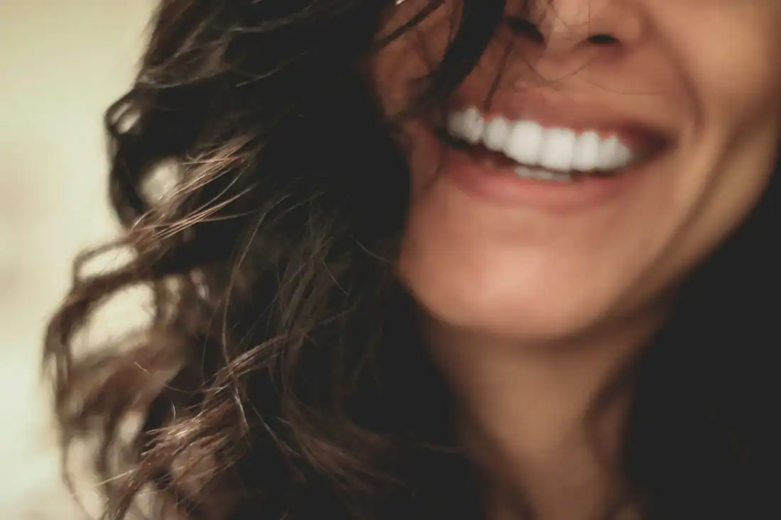 long black haired woman smiling close-up
