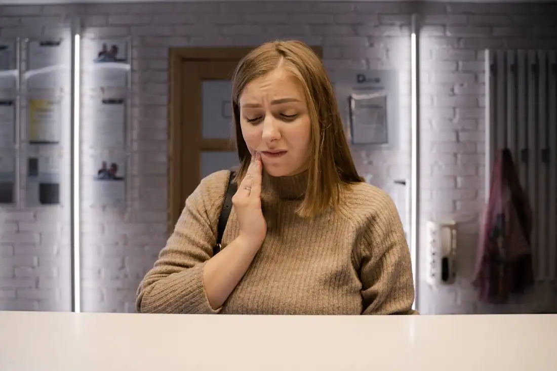 woman experiencing dental pain