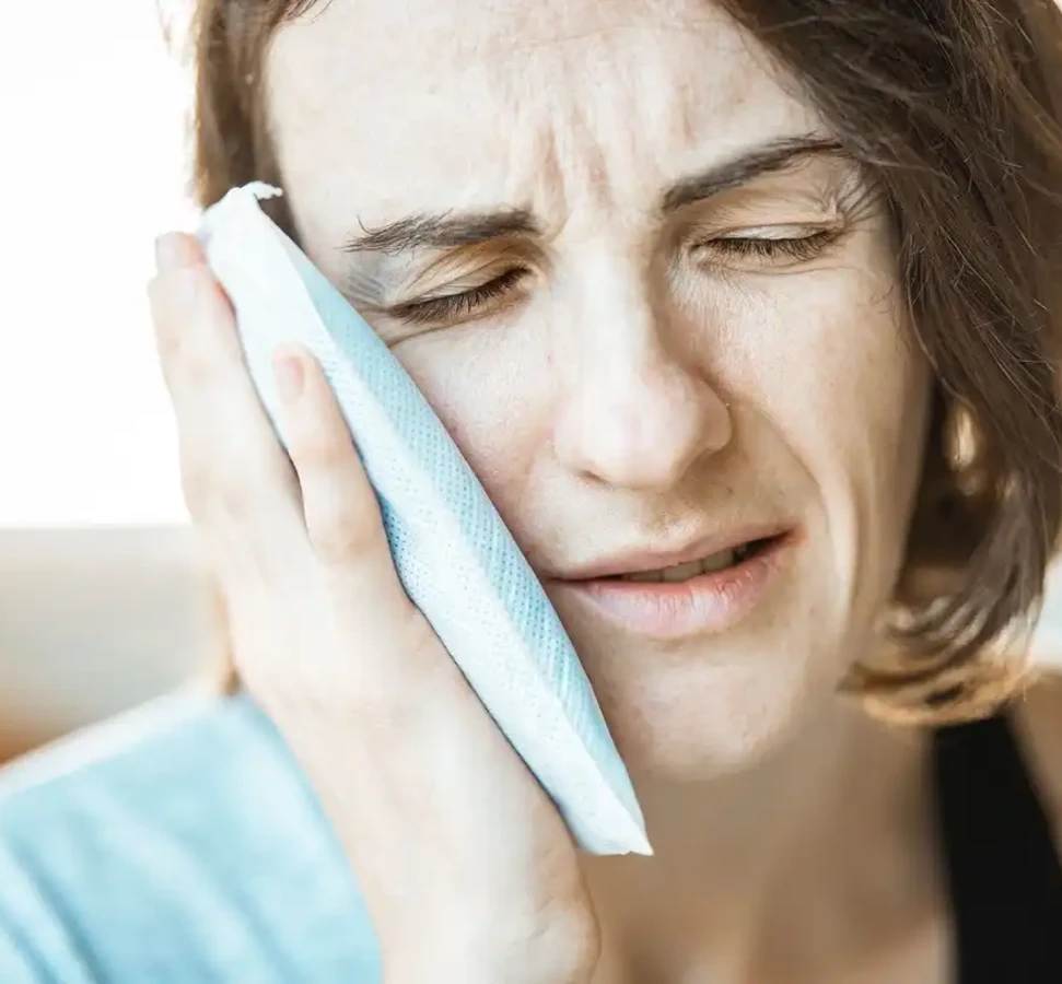 woman experiencing tooth sensitivity